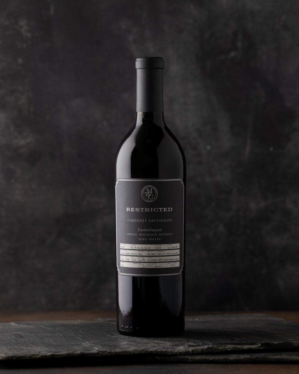 Single bottle of Restricted Cabernet against a dark background