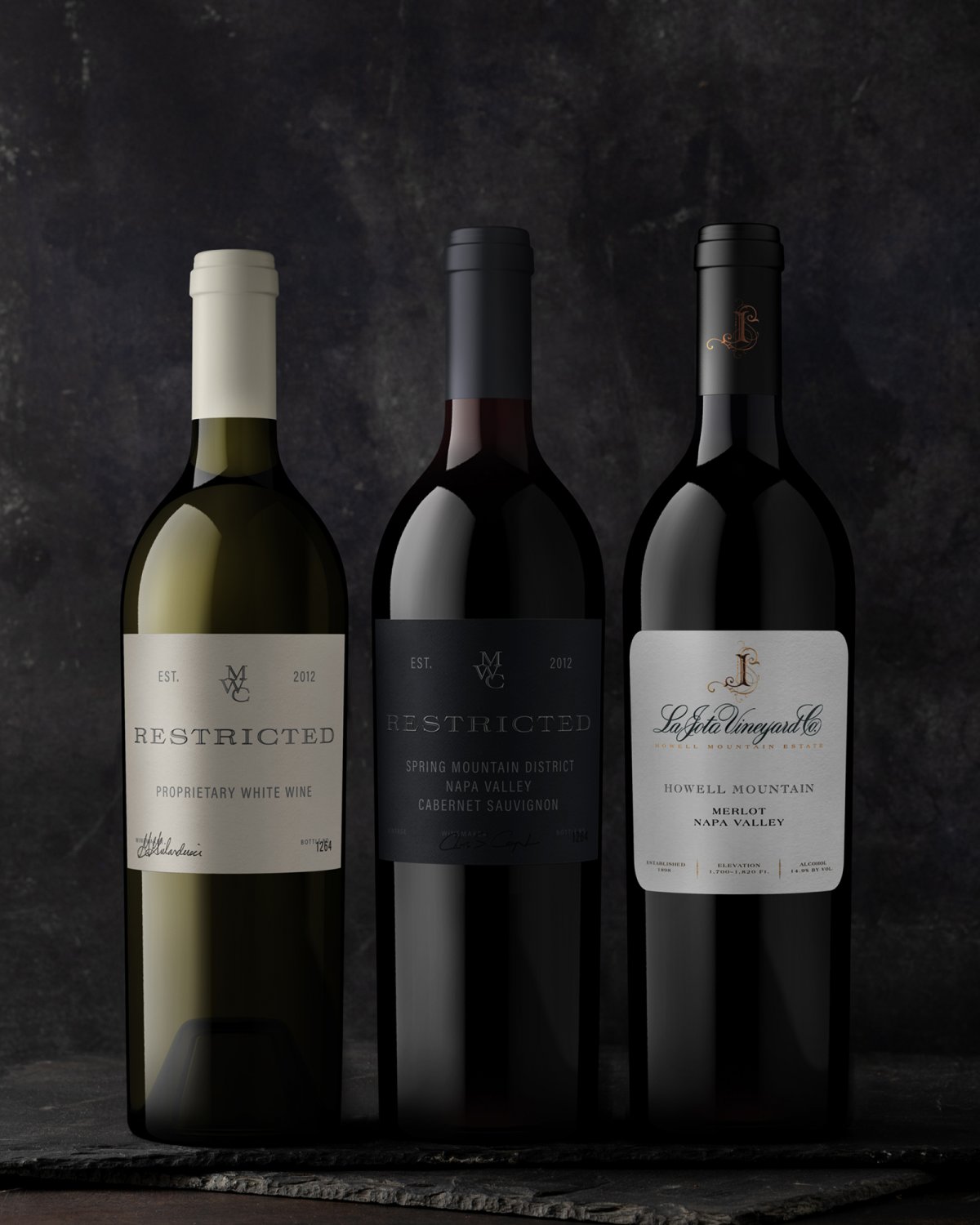Wine bottles against a dark background